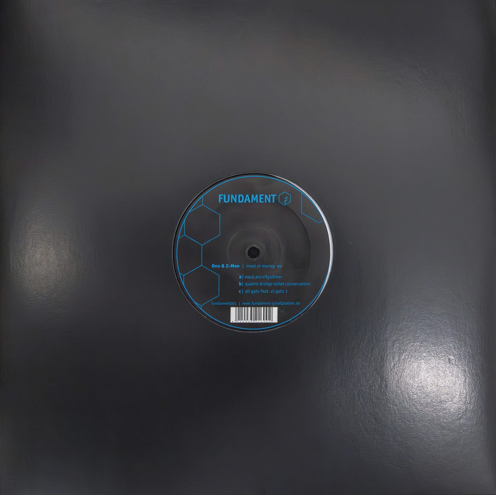 Die Platte Deo & Z-Man — Meat or Money EP mit blauem Fundament-Etikett in schwarzer Hülle.